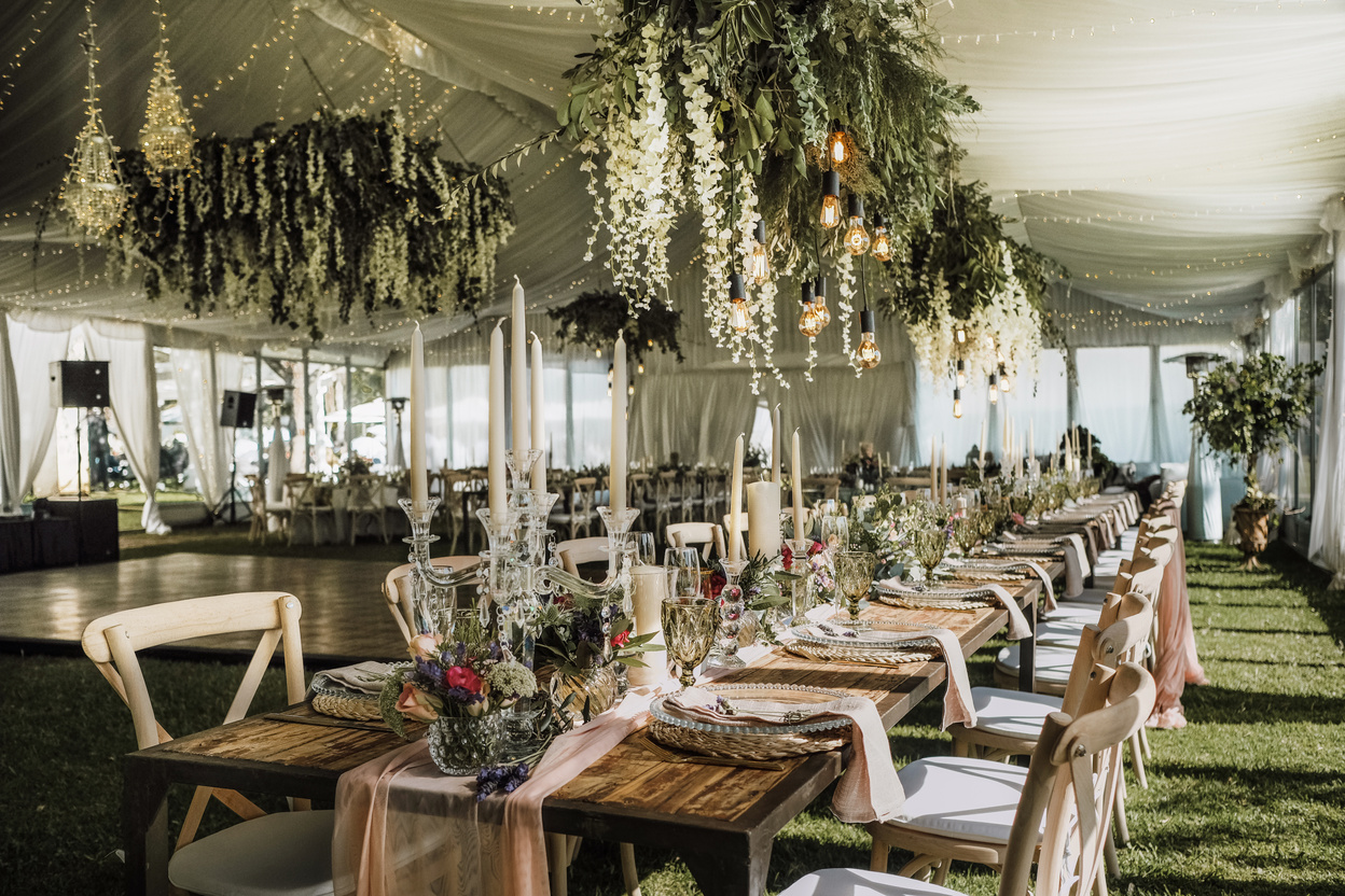 Photo of Tables and Chairs Near Hanging Flowers